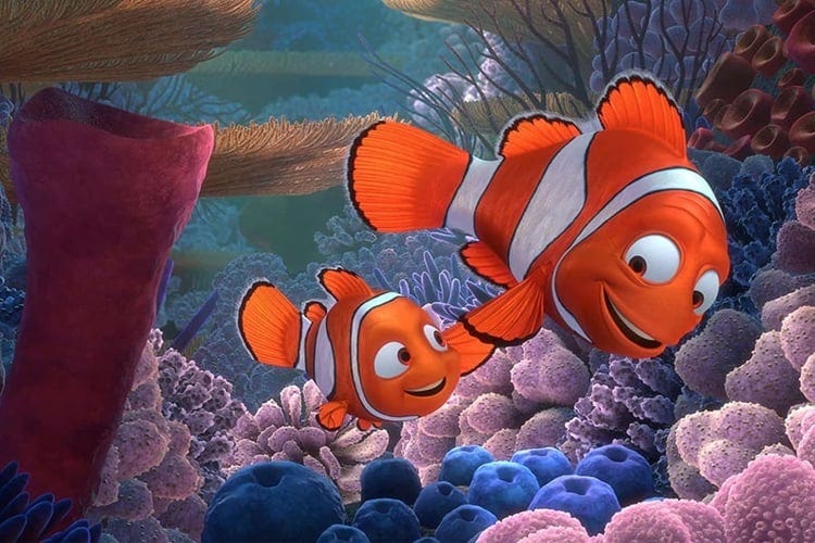 still from Finding Nemo with Nemo and his dad swimming through the reef