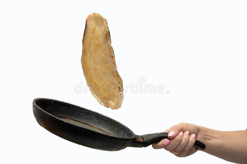 Toss the fried pancake in a pan, thin dough stock photography
