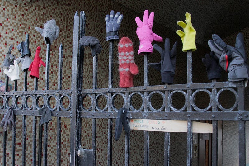 Single gloves on a fence in Iceland.