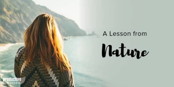 A woman sits with her back to us, overlooking the ocean. Text Overlay: A Lesson From Nature