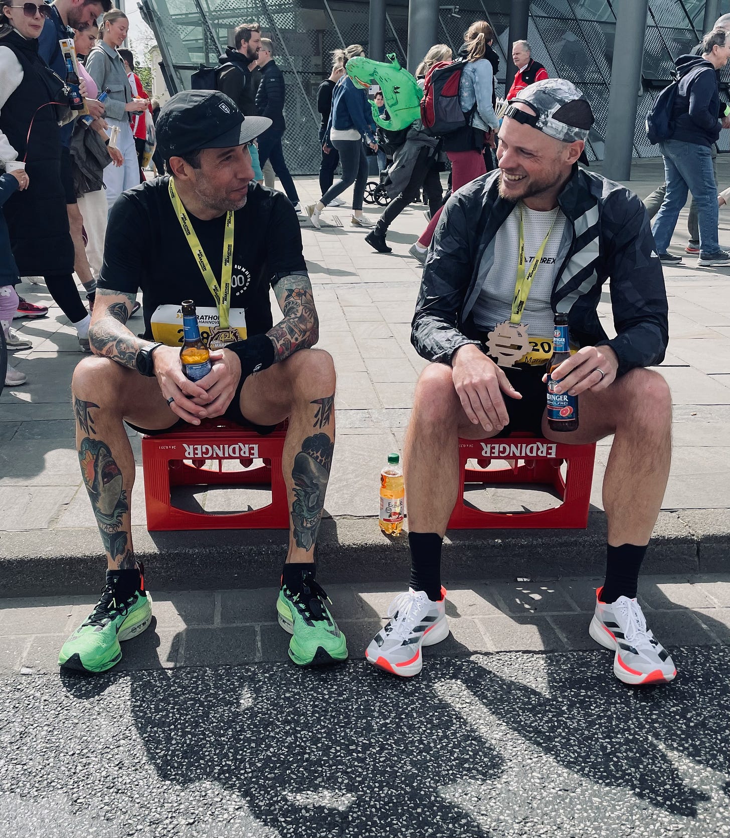 The author sitting on a beer crate after the race talking to his friend Marian Wilken