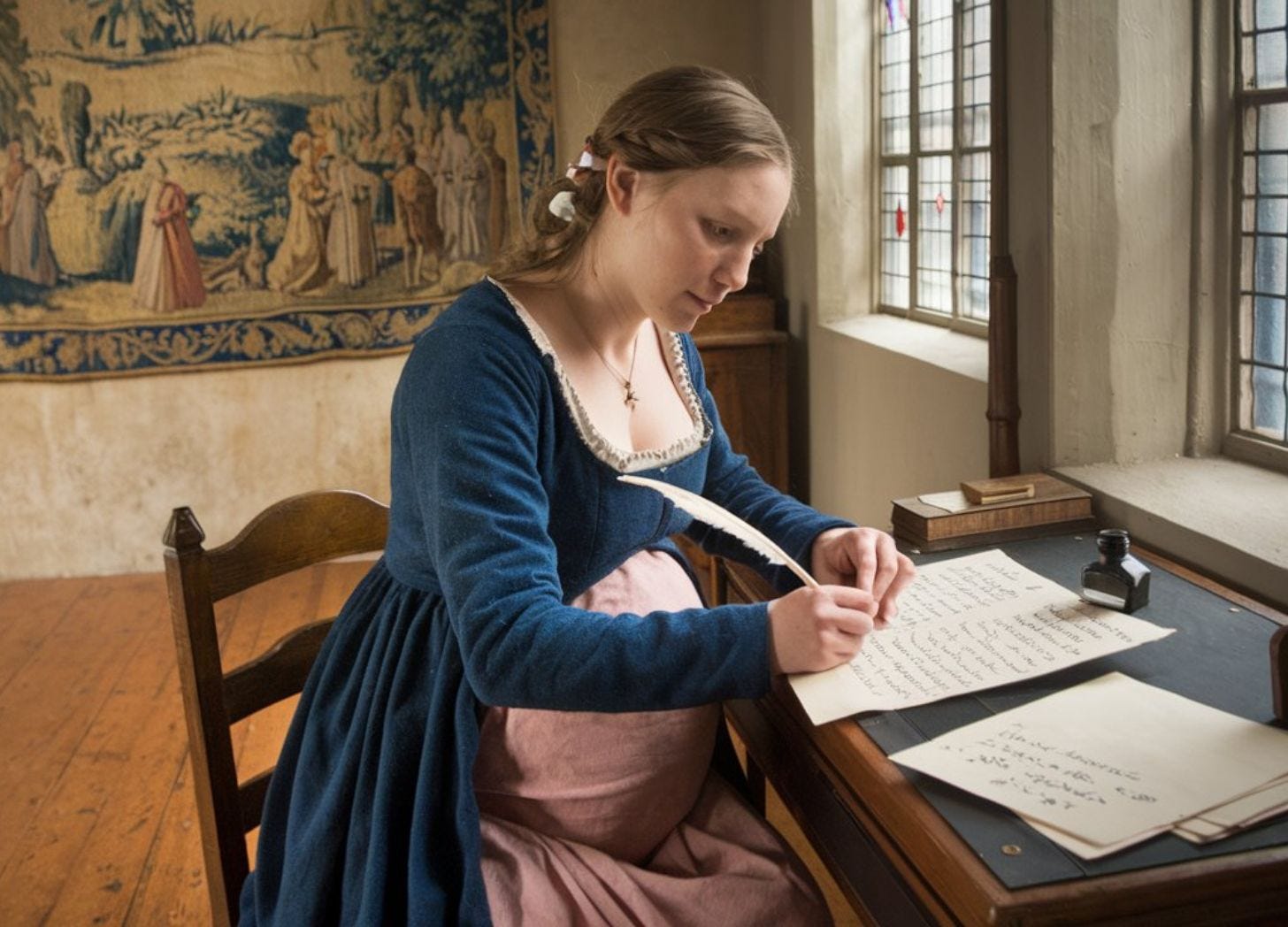 Pregnant woman in Medieval times sitting at her desk and writing a letter with a quill pen. Photo generated by https://ideogram.ai/