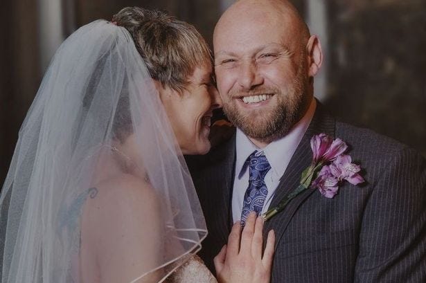 Happy times: Andy and Terry Maynard in their favourite wedding picture