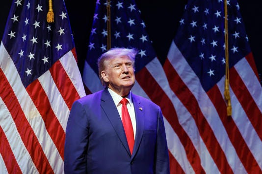 Former US President Donald Trump arrives on stage to speak about education policy at the Adler Theatre in Davenport, Iowa on March 13, 2023.
