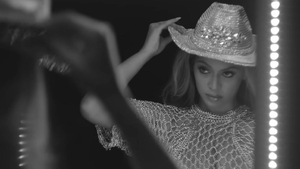 Black-and-white image of Beyoncé wearing a sparkly cowboy hat