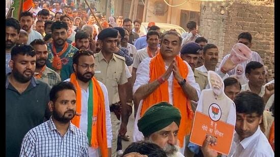 BJP candidate Sanjay Tandon during a foot march as part of campaigning in Chandigarh on Saturday. (HT Photo)