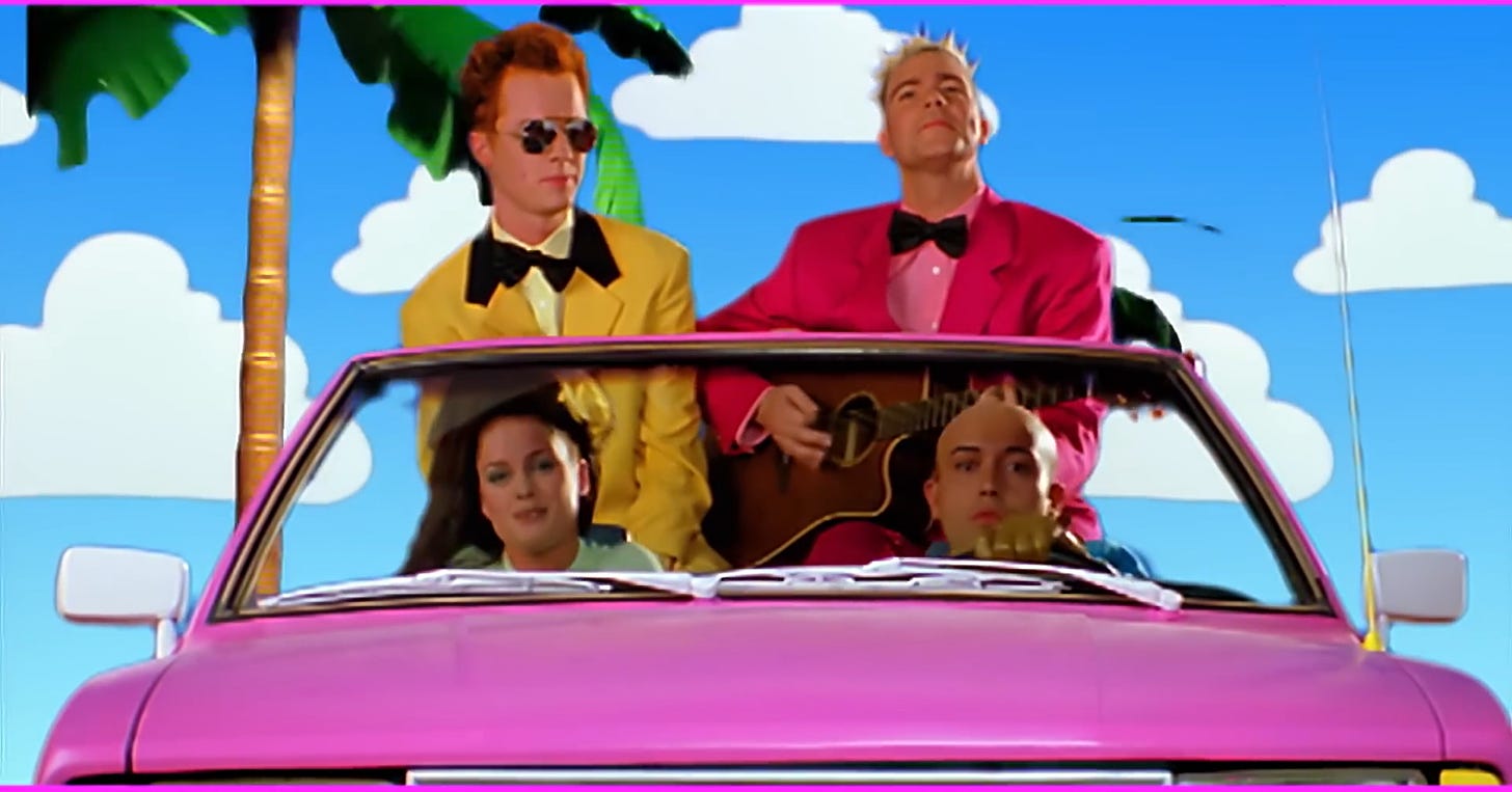Still from the music video from Aqua's "Barbie Girl": Four pals in a pink car.