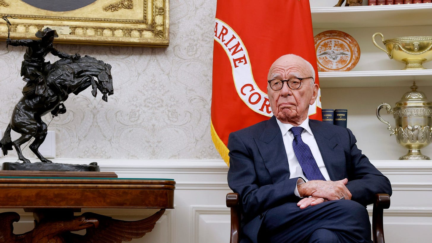 Rupert Murdoch listens as Donald Trump speaks to reporters in the Oval Office of the White House on February 3, 2025.