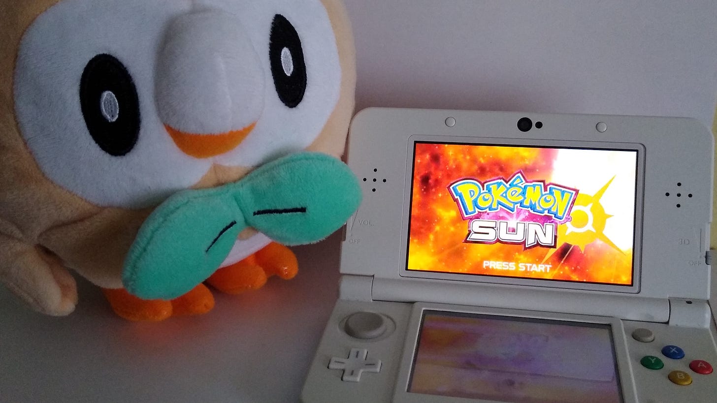 My copy of Pokémon Sun and Rowlet plush