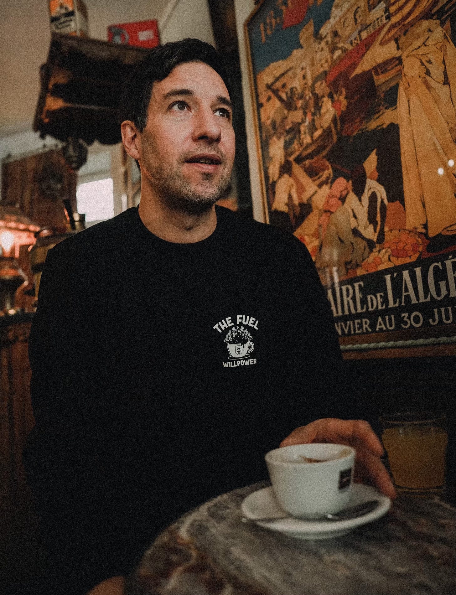 The author drinking coffee in a café