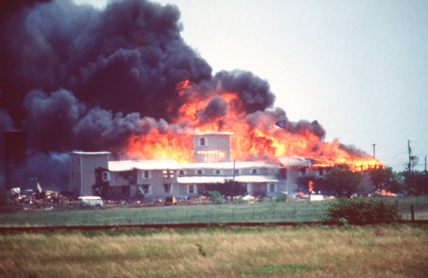 Church at Mt Carmel burning with seven dozen Texans trapped inside by Lon Horiuchi sniper fire