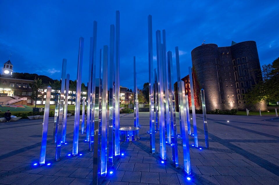 The Forest of Light on Keele University campus, lit up to blue to celebrate NHS 75 anniversary