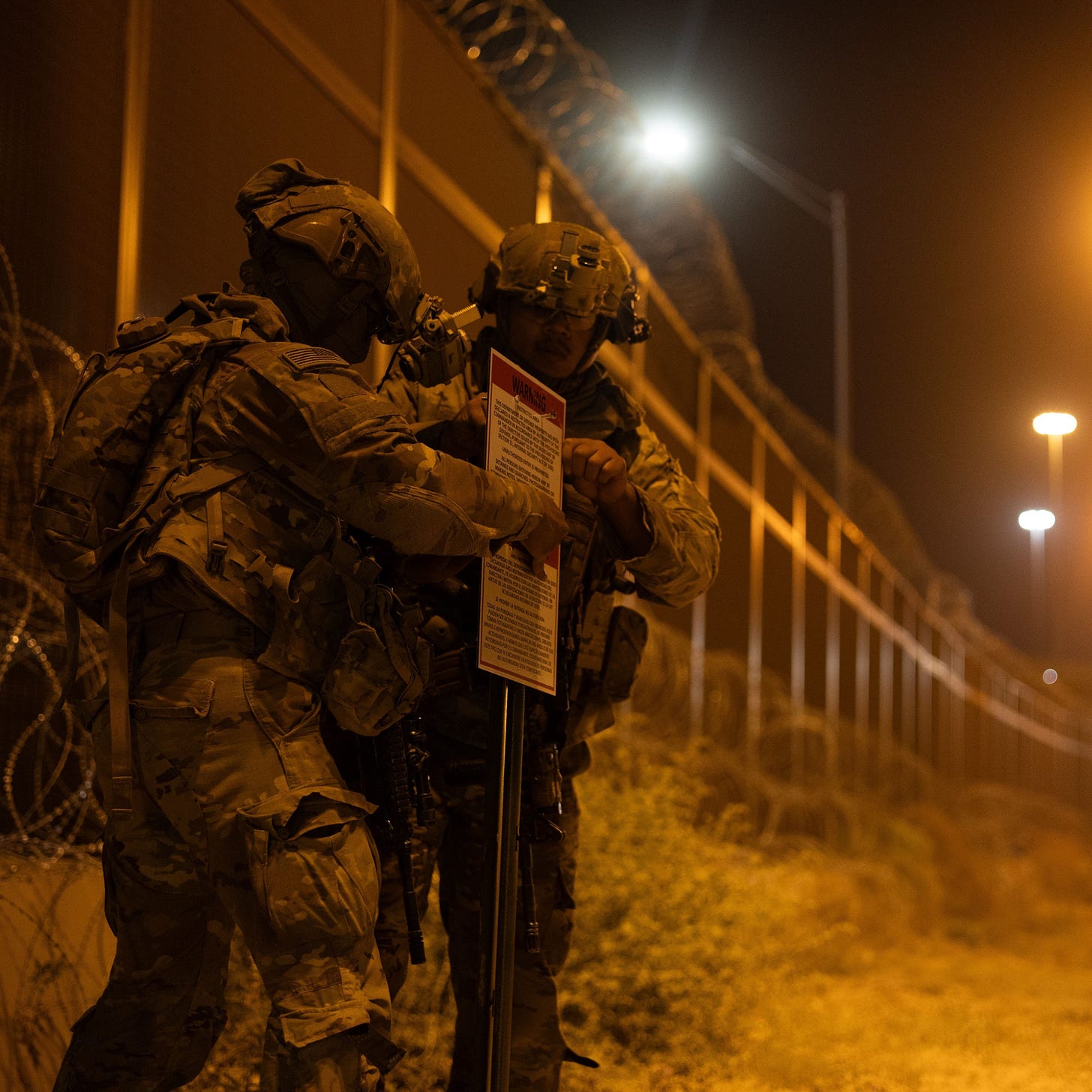 Soldiers install a sign warning against trespass into a newly designated "Texas National Defense Area" on the border @ Fort Bliss in El Paso. Soldiers install a sign warning against trespass into a newly designated "Texas National Defense Area" on the border @ Fort Bliss in El Paso.