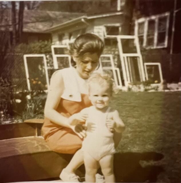 My mother, aged about 25, and me, about 18 months. I have a very determined look on my face. She looks worried. 