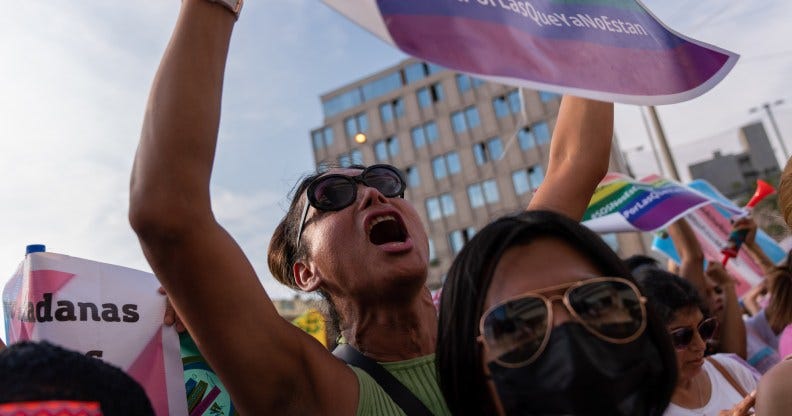 LIMA, PERU - 2023/02/23: A protester chants slogans while holding a placard outside the criminal investigation department (DININCRI) during the demonstration. Organizations march in Lima and in other regions to demand faster investigations and justice for transphobic attack victims. To date, at least seven trans women in Peru have been murdered. (Photo by Guillermo Gutierrez Carrascal/SOPA Images/LightRocket via Getty Images)