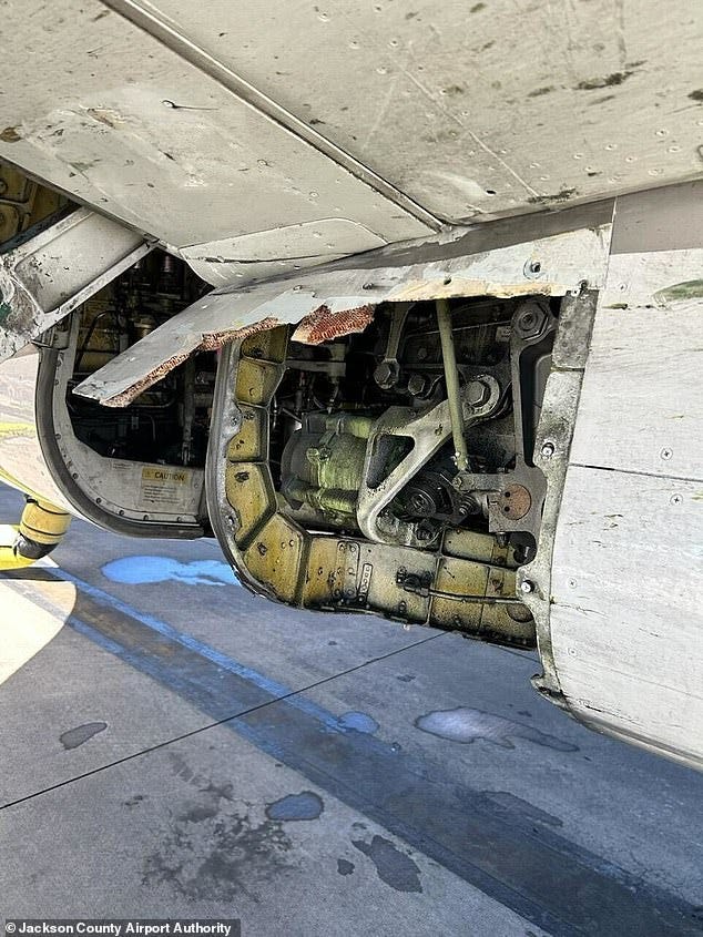 A United Airlines plane built by Boeing was grounded on March 15 after it was found to be missing a panel when it touched down following a flight. Pictured: The missing part on the 25-year-old Boeing 737-824, which is older then the Max models