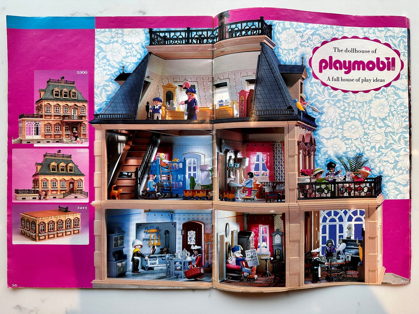 Two-page catalog spread of Victorian Playmobil house interior, with kitchen, living room, bedrooms, and bathroom play sets arranged inside.