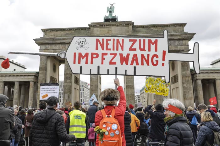 Demonstrators at a 2022 protest in Berlin against proposals for a vaccine mandate