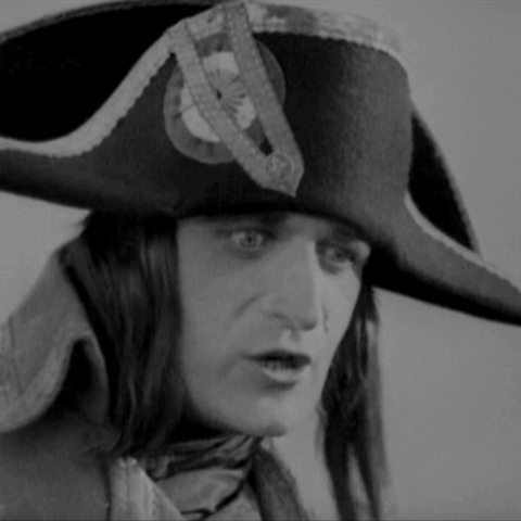 Napoleon, in Abel Gance's 1927 film, addresses a crowd from his horse in big close-up. He throws up his arm to point at the horizon