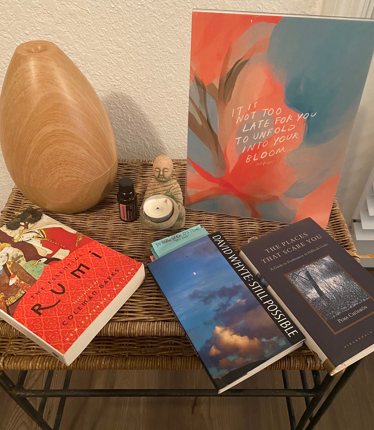 altar showing buddha candle and books