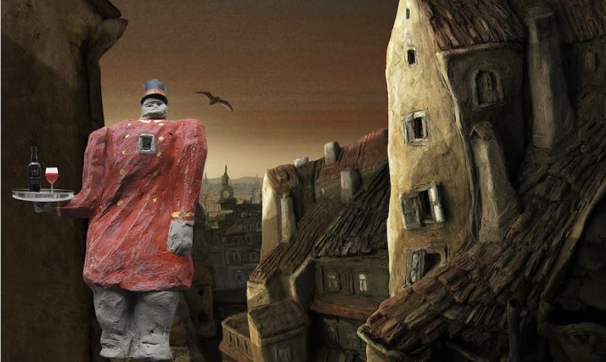 A clay waiter stands before a clay cityscape.