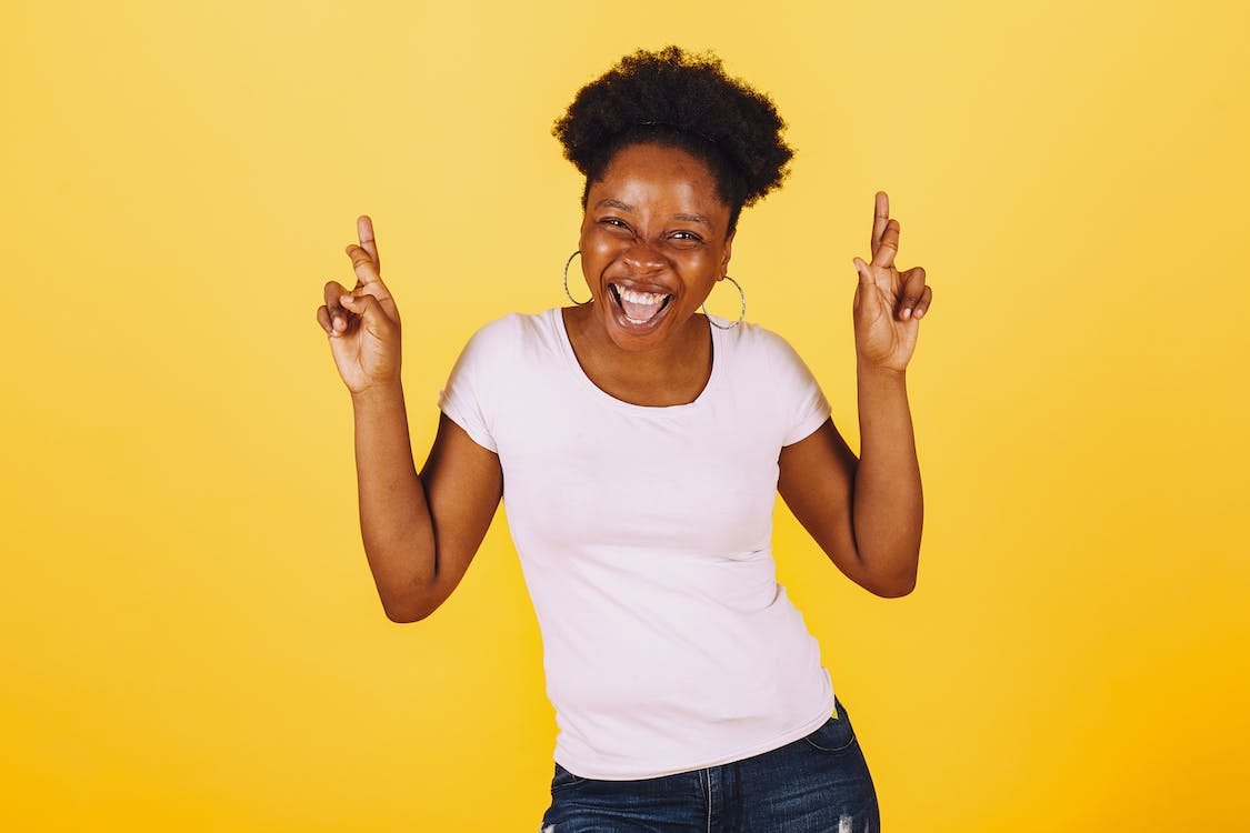 Free Woman in White Shirt Smiling Widely Stock Photo