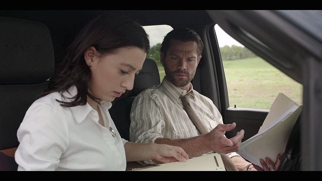 Cassie looking through case files in truck with Cordell Walker 3.5.