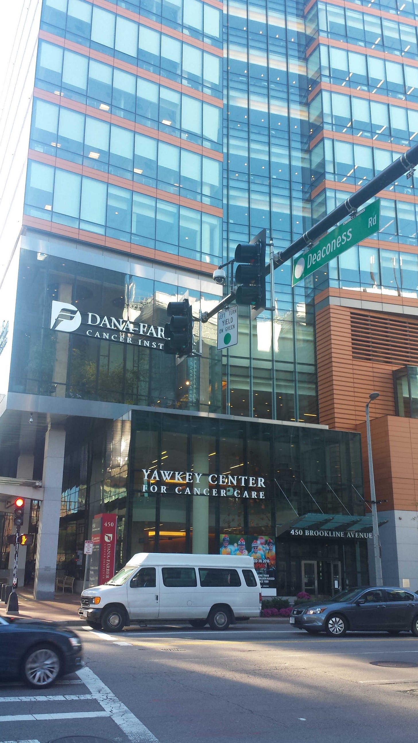 A tall building with "DANA-FARBER CANCER INSTITUTE" written on it, pictured from the street A tall building with "DANA-FARBER CANCER INSTITUTE" written on it, pictured from the street