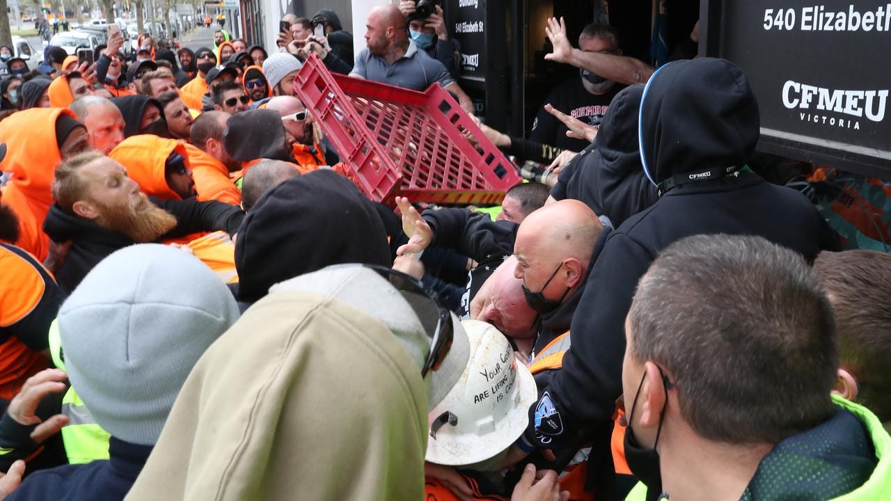 Social media footage showed bread crates and water bottles hurled towards union representatives trying to calm the situation. Picture: David Crosling