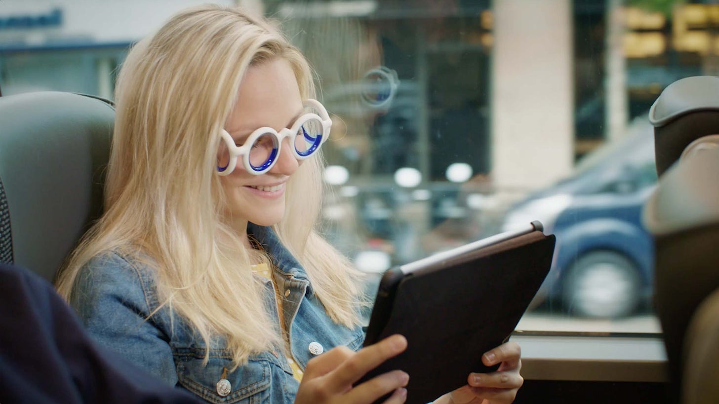 A woman is wearing specially designed glasses that help her avoid travel sickness.