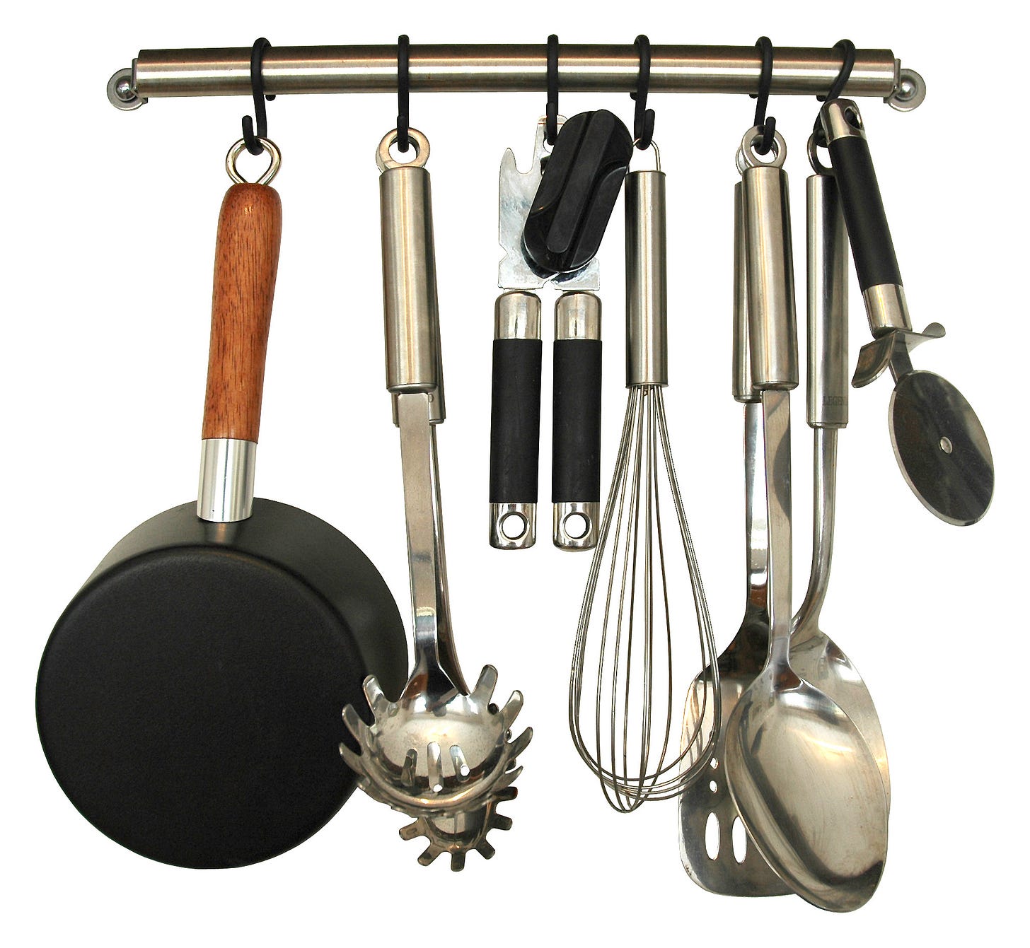 various kitchen tools hanging on a rack including a saucepan, whisk, and ladles