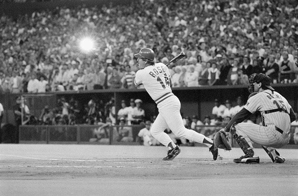 Pete Rose, batting, as he becomes baseball’s all-time hits leader on September 11th, 1985 (Photo: Bettmann Archive/Getty Images).