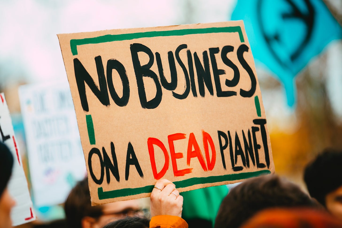 Sign that reads No Business On A Dead Planet
