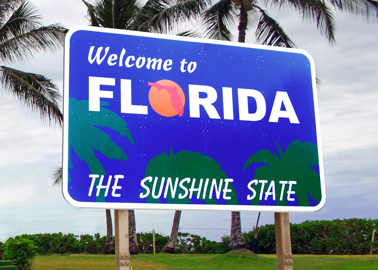 Sign that reads "Welcome to Florida: The Sunshine State."