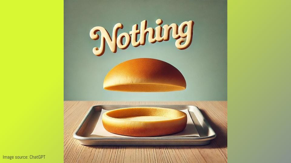 A slide with an image on it that has the word "Nothing" at the top and then a hamburger bun but with nothing between the two buns (just air).  the bun is in a simple tray on a table.