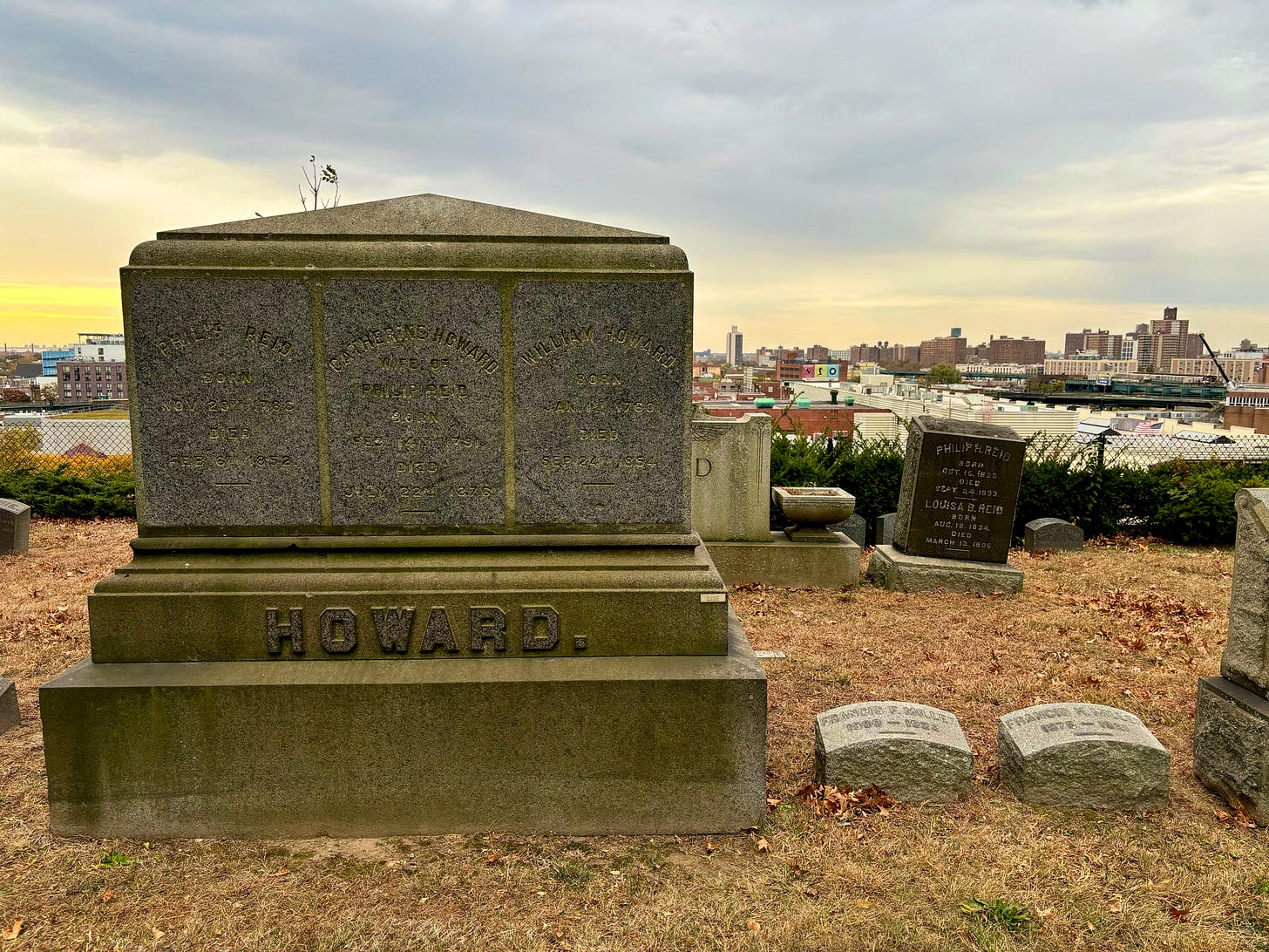 The Howard family monument. William Howard (1760 - 1854) is on the right. The intersection of Broadway and Jamaica where Howard's Tavern once stood can be seen in the distance.