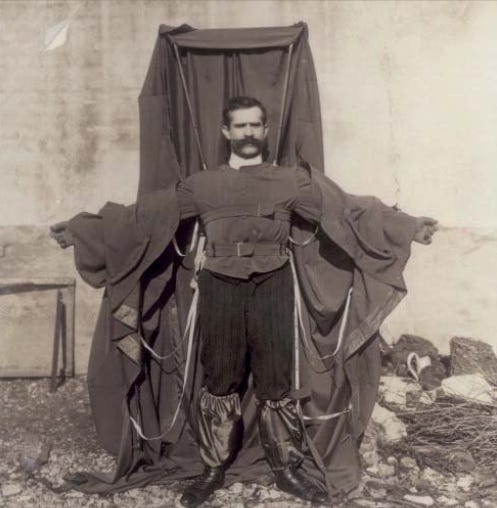 A man wearing a frame draped in material