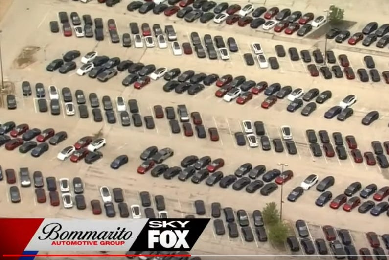 AU0:44 / 1:56 Hundreds of Tesla vehicles parked outside Chesterfield Mall. Why? 