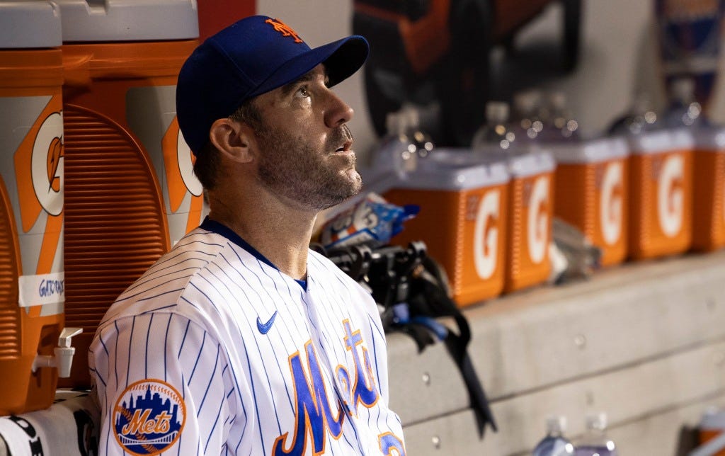 A dejected Justin Verlander sits in the dugout after the fifth inning in the Mets' loss.