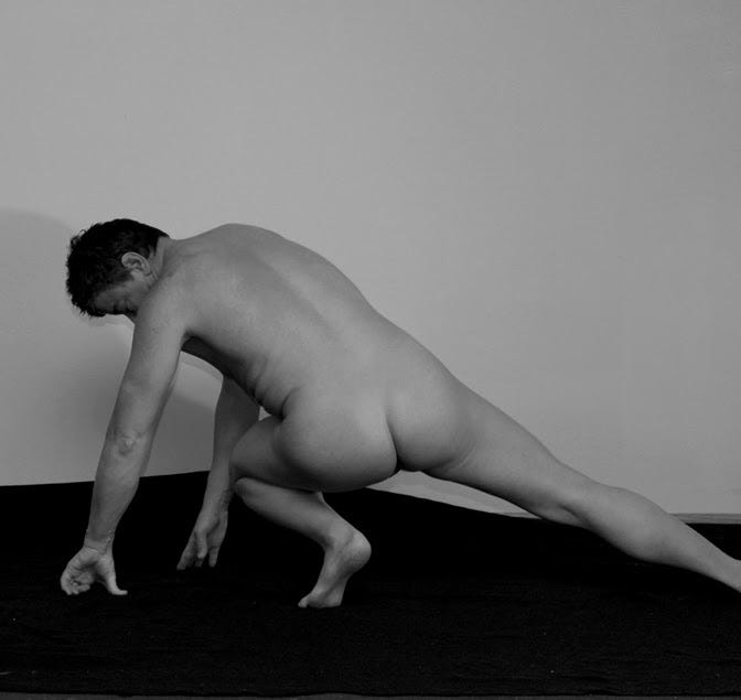 Naked Man Yoga Pose on Floor