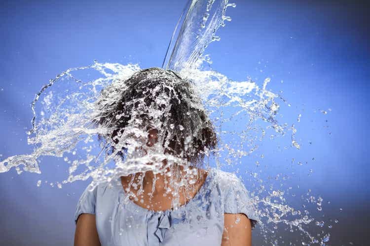 Woman being splashed with water