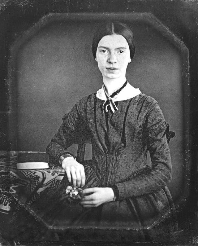 Emily Dickinson, black and white image of woman posing for photograph