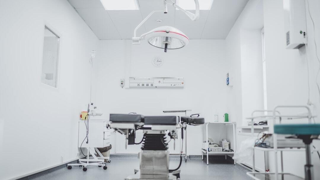 black and white hospital bed in the middle of interior building black and white hospital bed in the middle of interior building