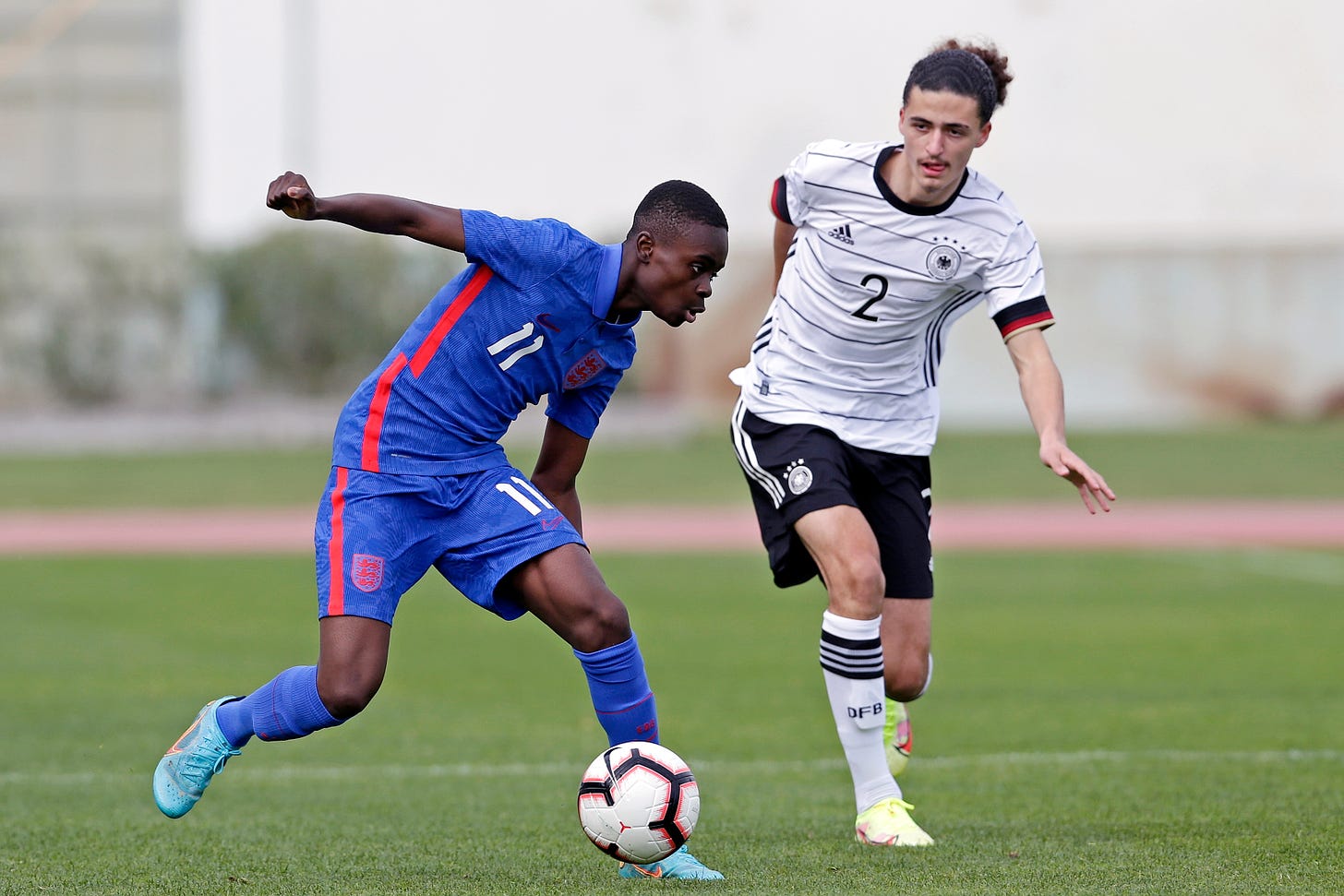 Tyrique George pictured (left) playing for England against Germany in a U16 international in February 2022
