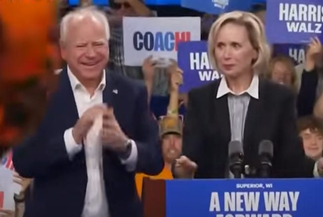 Tim Walz with her husband, Gwen, onstage at the DNC.