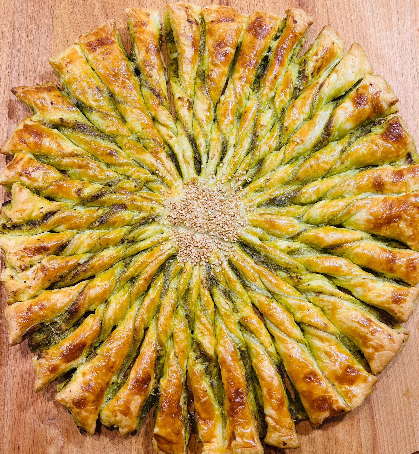 Closeup of a French puff pastry tarte au soleil or sun tart, a simple French appetizer that looks like the sun