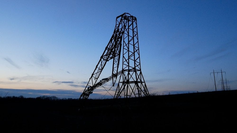 A high-voltage power tower broken as a result of a Russian missile strike against the sky. 