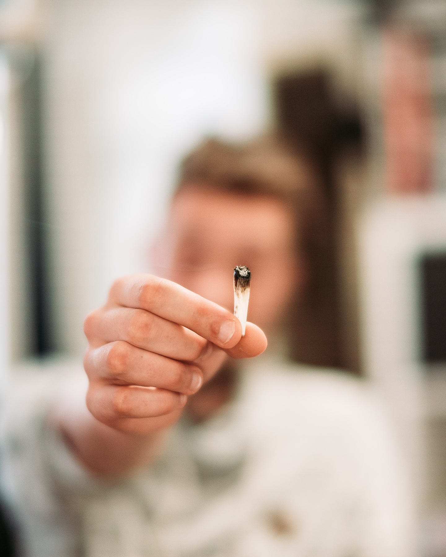 Fingers holding a joint