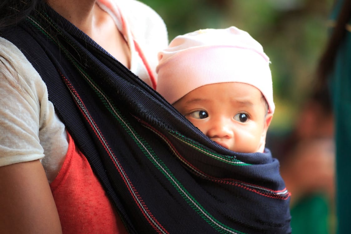 Free Woman Carrying Baby Stock Photo