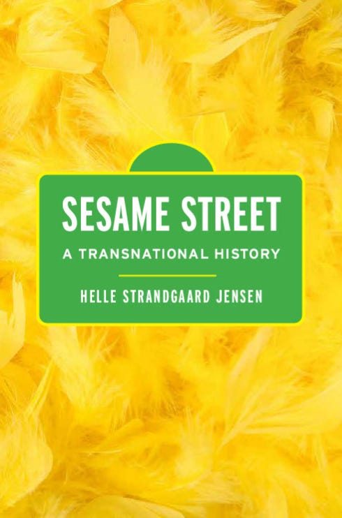 The cover of Sesame Street: A Transnational History. The cover imagery evokes the Sesame Street sign and Big Bird's yellow feathers